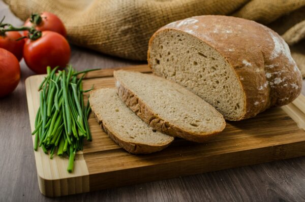 Healthy breakfast - homemade beer bread with cheese, tomatoes and chives